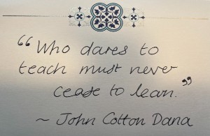 Handwritten card saying 'Who dares to teach must never cease to learn' by John Cotton Dana