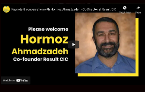 Still from video introducing Hormoz as keynote speaker