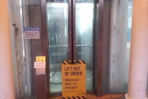 Broken lift with Out Of Order sign